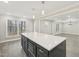 Open-concept kitchen island with large countertop and modern fixtures at 4436 Talcott Dr, Durham, NC 27705