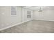 Inviting living space with elegant chandelier, light gray walls, and beautiful gray wood floors at 4436 Talcott Dr, Durham, NC 27705
