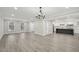 The living room has neutral paint and flooring, with an open concept to the kitchen and dining room at 4436 Talcott Dr, Durham, NC 27705