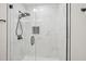 Modern shower featuring stylish tile, sleek fixtures, and glass enclosure at 4436 Talcott Dr, Durham, NC 27705