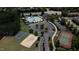 An aerial view of a community pool, sand volleyball court, playground, and tennis court at 532 Front Ridge Dr, Cary, NC 27519