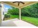 Covered back patio with a ceiling fan overlooks the backyard at 532 Front Ridge Dr, Cary, NC 27519