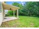 Covered back patio with ceiling fan overlooking the backyard and lawn at 532 Front Ridge Dr, Cary, NC 27519