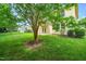 Lush backyard view showing the home's exterior, patio, and double doors at 532 Front Ridge Dr, Cary, NC 27519