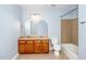 Bathroom with dual sinks, a bathtub, and tiled floors offers a functional and modern space at 532 Front Ridge Dr, Cary, NC 27519
