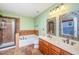 The bathroom features a soaking tub, a separate shower, and dual sinks with decorative mirrors at 532 Front Ridge Dr, Cary, NC 27519