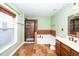 Well-lit bathroom featuring double sinks, glass enclosed shower, and separate soaking tub at 532 Front Ridge Dr, Cary, NC 27519