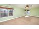 Bright bedroom with three windows offers natural light and views of the outdoors at 532 Front Ridge Dr, Cary, NC 27519