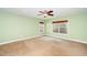 A sunlit bedroom awaits your personal touch with its neutral carpet and serene green walls at 532 Front Ridge Dr, Cary, NC 27519