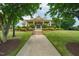 A beautiful clubhouse with manicured landscaping and a welcoming entrance at 532 Front Ridge Dr, Cary, NC 27519