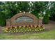 A brick entrance sign for Twin Lakes surrounded by flowers at 532 Front Ridge Dr, Cary, NC 27519