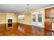 Dining area features a chandelier, fireplace, and access to the outdoor patio at 532 Front Ridge Dr, Cary, NC 27519