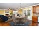 Staged dining area features a chandelier, fireplace, and access to the living area at 532 Front Ridge Dr, Cary, NC 27519