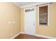 Bright entryway with hardwood floors, a white door, and natural light from the window at 532 Front Ridge Dr, Cary, NC 27519