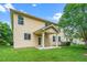 The backyard view shows the home's exterior and covered back patio at 532 Front Ridge Dr, Cary, NC 27519
