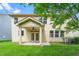 The backyard view shows the home's exterior and covered back patio with french doors at 532 Front Ridge Dr, Cary, NC 27519
