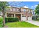 Charming two-story home featuring a stone facade, covered porch, and two-car garage at 532 Front Ridge Dr, Cary, NC 27519