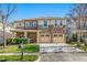 Charming two-story home boasts a stone facade, multi-car garage, and well-manicured lawn in a desirable neighborhood at 532 Front Ridge Dr, Cary, NC 27519
