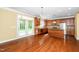 Bright kitchen features wood cabinets, stainless steel appliances, and backyard access at 532 Front Ridge Dr, Cary, NC 27519