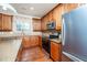 Modern kitchen with stainless steel appliances, stone countertops, and hardwood floors at 532 Front Ridge Dr, Cary, NC 27519