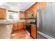 Gourmet kitchen featuring stainless steel appliances and sleek, modern finishes at 532 Front Ridge Dr, Cary, NC 27519