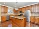 Kitchen featuring wood cabinets, stainless steel appliances, and a center island at 532 Front Ridge Dr, Cary, NC 27519