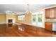 Bright living room with a fireplace, hardwood floors, and large windows allows ample natural light at 532 Front Ridge Dr, Cary, NC 27519