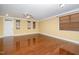 Open living room with hardwood floors, neutral paint, and ample natural light at 532 Front Ridge Dr, Cary, NC 27519