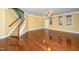 Inviting living room featuring hardwood floors, a staircase, and natural light at 532 Front Ridge Dr, Cary, NC 27519