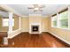 Living room features a cozy fireplace, columns, hardwood floors, and natural light at 532 Front Ridge Dr, Cary, NC 27519