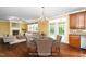 Bright living room with a fireplace, hardwood floors, and ample seating makes the home warm and inviting at 532 Front Ridge Dr, Cary, NC 27519