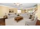 Staged living room features neutral furniture, wooden coffee table, and adjacent dining area at 532 Front Ridge Dr, Cary, NC 27519