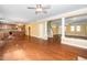 Open concept living area featuring hardwood floors and seamless transition to kitchen and staircase at 532 Front Ridge Dr, Cary, NC 27519