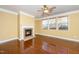 Cozy living room featuring a fireplace, hardwood floors, and bright natural light at 532 Front Ridge Dr, Cary, NC 27519