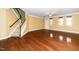 Bright living room with hardwood floors, staircase, and neutral wall colors at 532 Front Ridge Dr, Cary, NC 27519