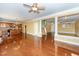 Spacious living room showcasing hardwood floors, a ceiling fan, and natural lighting at 532 Front Ridge Dr, Cary, NC 27519