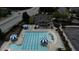 Aerial view of community pool with blue umbrellas and plenty of lounge chairs at 532 Front Ridge Dr, Cary, NC 27519