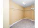 Well-lit walk-in closet with wall-mounted shelving at 532 Front Ridge Dr, Cary, NC 27519