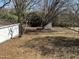 Large backyard with mature trees, shed, and ample space for outdoor activities at 630 North Ave, Burlington, NC 27217