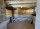 Unfinished basement area featuring exposed ductwork and wooden framing, offering potential for customization at 630 North Ave, Burlington, NC 27217