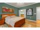 Spacious bedroom showcasing an ensuite bath and large window at 726 Finnbar Dr, Cary, NC 27519