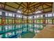 Community indoor pool with blue lane lines and a vaulted wood ceiling with large windows at 726 Finnbar Dr, Cary, NC 27519