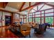 Bright living room with wooden floors, vaulted ceiling, exposed beams, and large windows at 726 Finnbar Dr, Cary, NC 27519