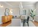 Elegant dining room featuring a chandelier, hardwood floors, and wainscoting at 9132 Sanctuary Ct Ct, Raleigh, NC 27617