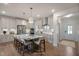 Spacious kitchen featuring a large island, stainless steel appliances, and pendant lighting at 15 Merle Dr, Wendell, NC 27591