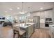 Open-concept kitchen with stainless steel appliances, a large island, and modern fixtures at 15 Merle Dr, Wendell, NC 27591