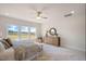 Well-lit main bedroom featuring large windows, a ceiling fan, and light-toned decor and finishes at 15 Merle Dr, Wendell, NC 27591