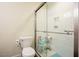 Contemporary bathroom featuring a glass-enclosed shower, a toilet, and white subway tiles at 10 Marchmont Ct, Durham, NC 27705