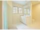 Bright bathroom with double vanity, a large mirror, and a shower with curtain at 10 Marchmont Ct, Durham, NC 27705