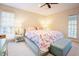 Cozy bedroom featuring bright natural light and a floral patterned bedspread at 10 Marchmont Ct, Durham, NC 27705